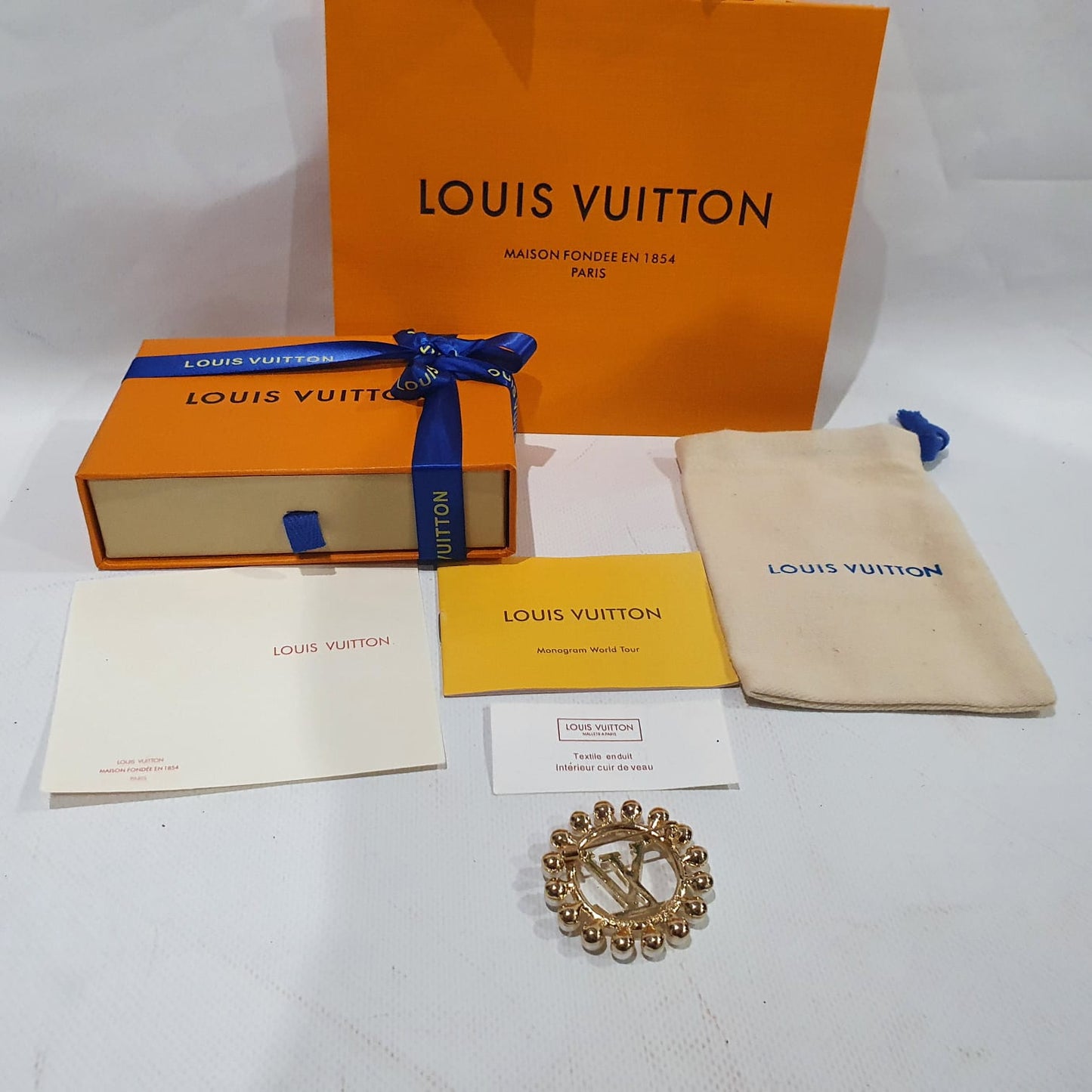 Louis Vuitton brooch Crossbody