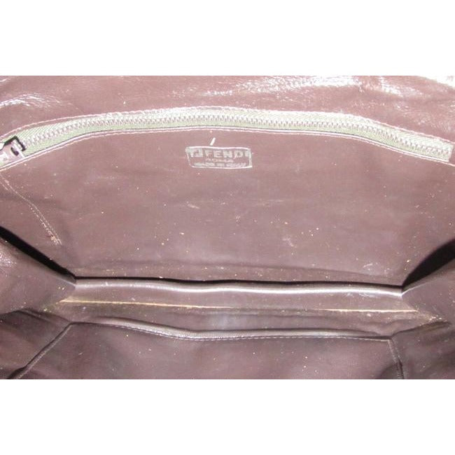 Fendi Purses Brown Woven Leather With A Leather Strap Handle In The Back Clutch