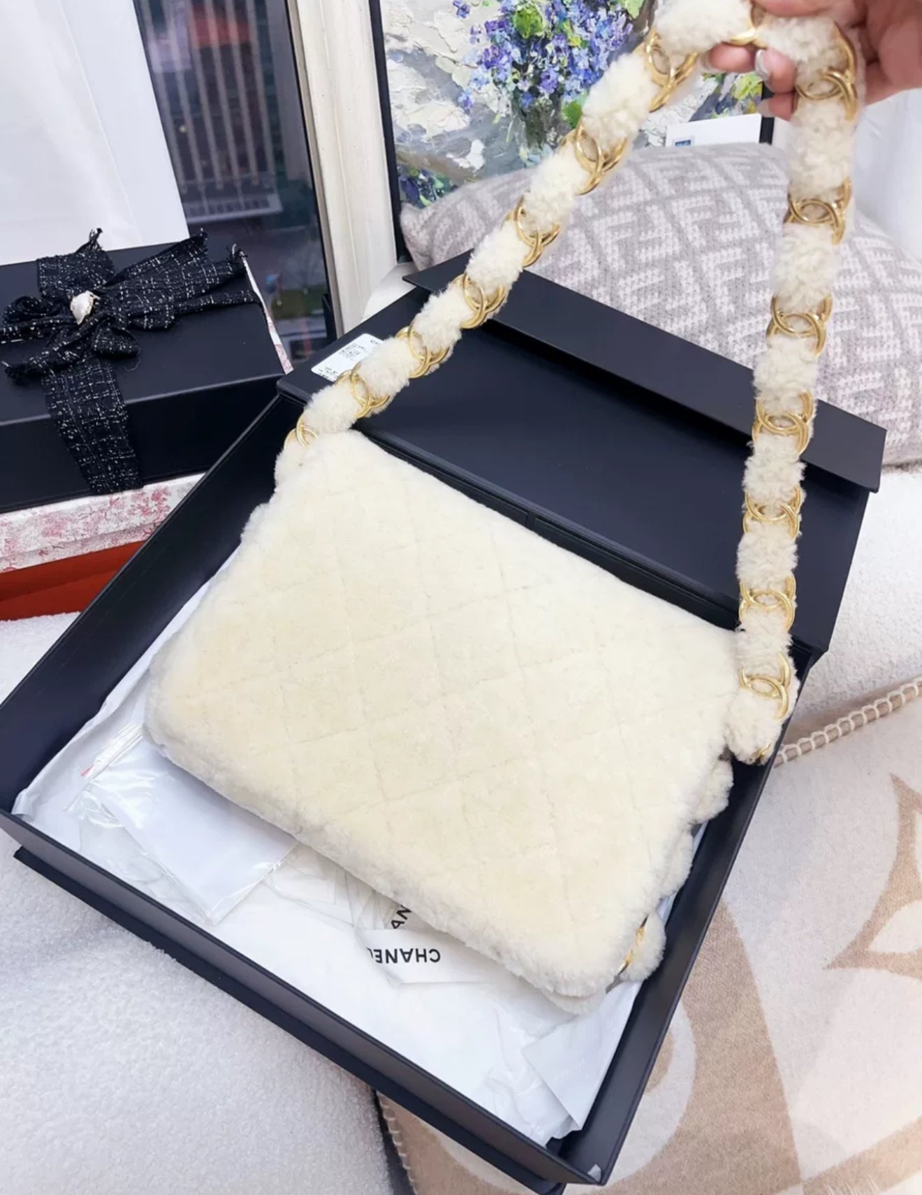 Chanel 24K off-white shearling chain flap bag with gold hardware