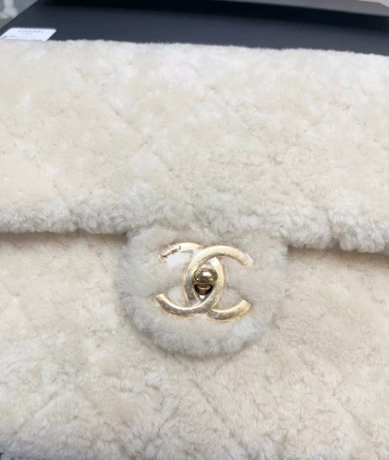 Chanel 24K off-white shearling chain flap bag with gold hardware