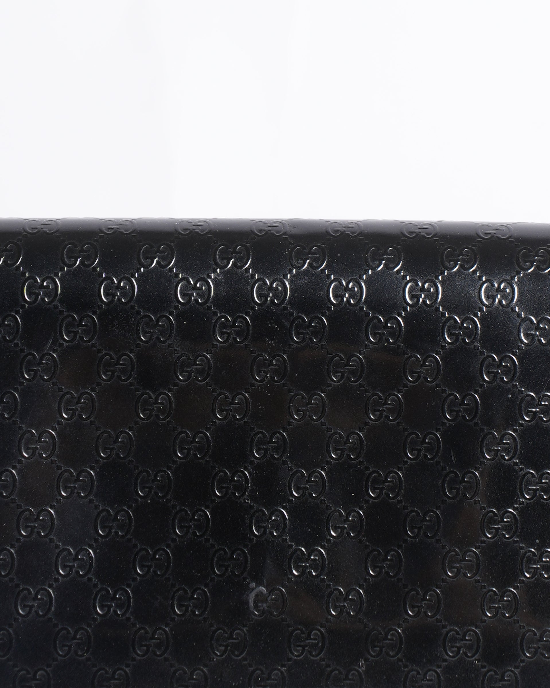 Gucci Monogram Leather Clutch