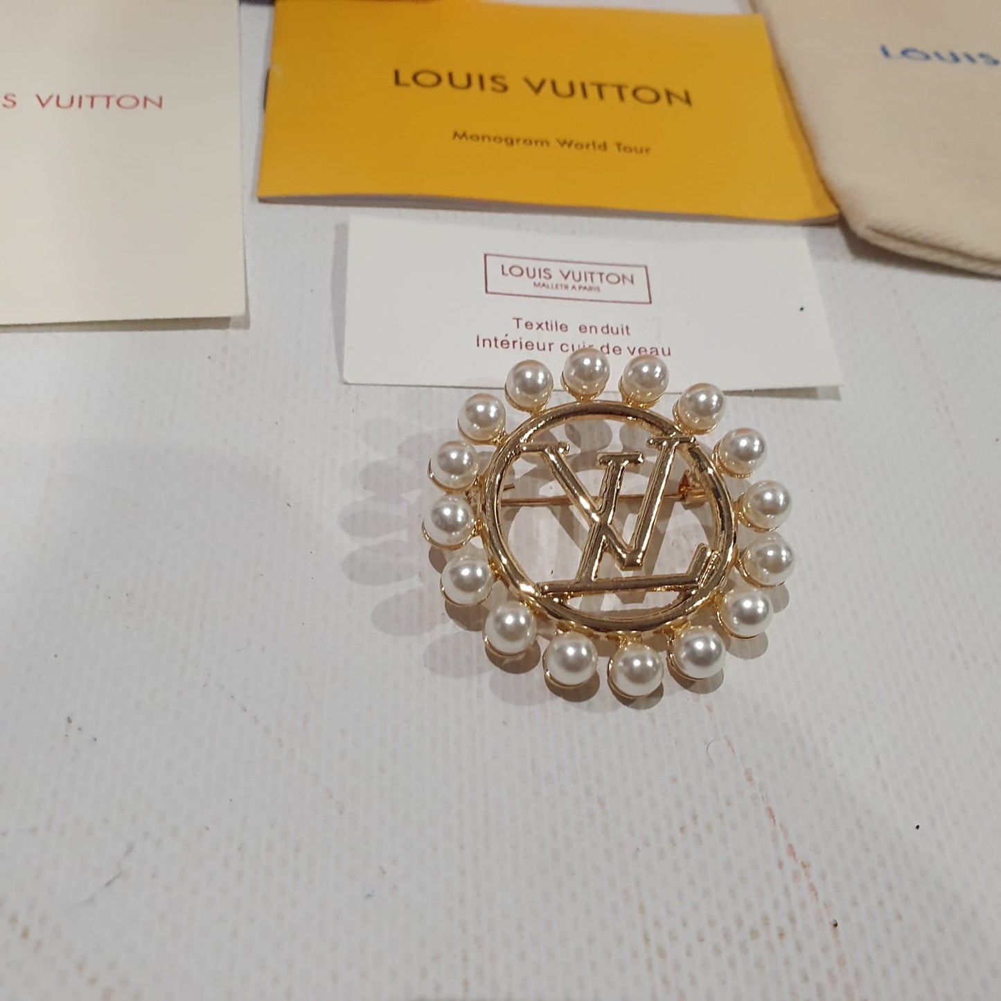 Louis Vuitton brooch Crossbody