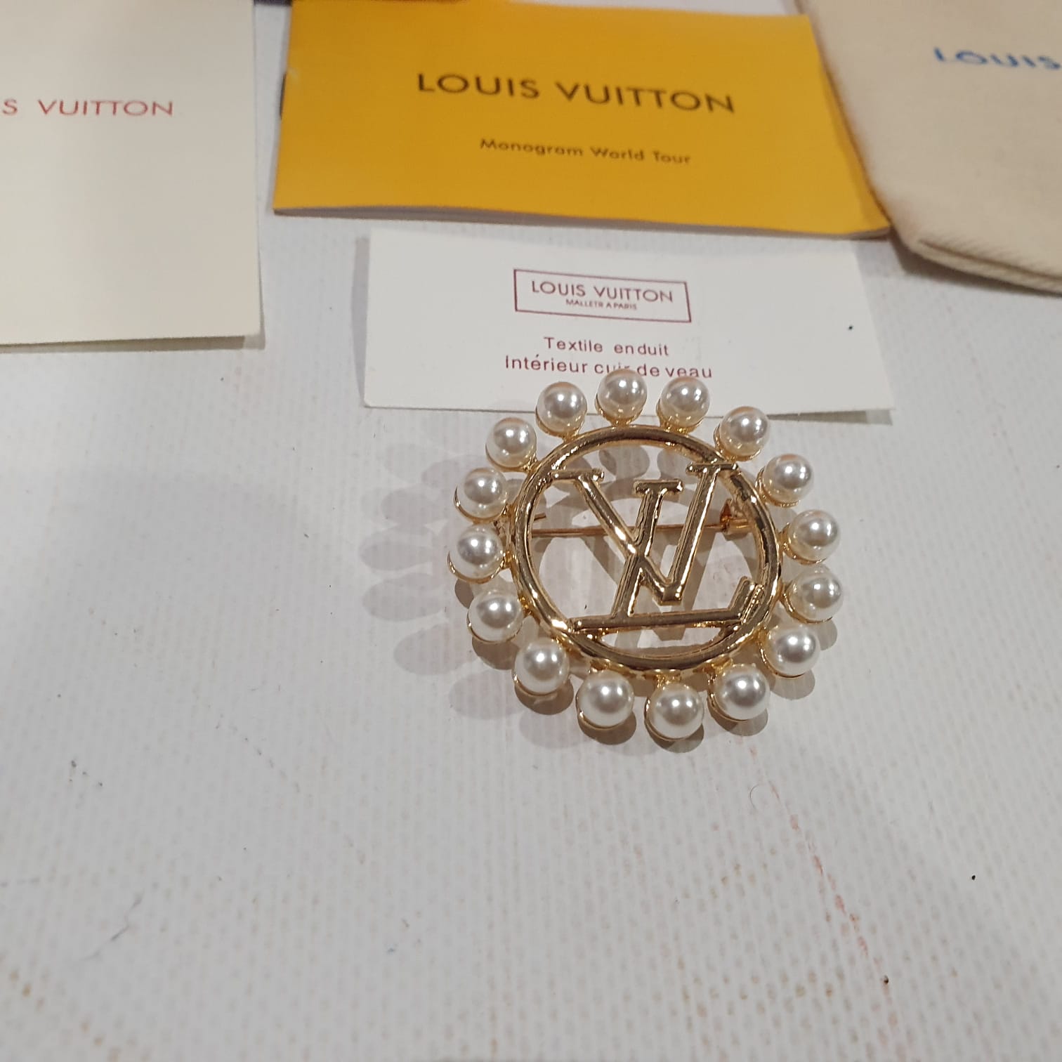 Louis Vuitton brooch Crossbody