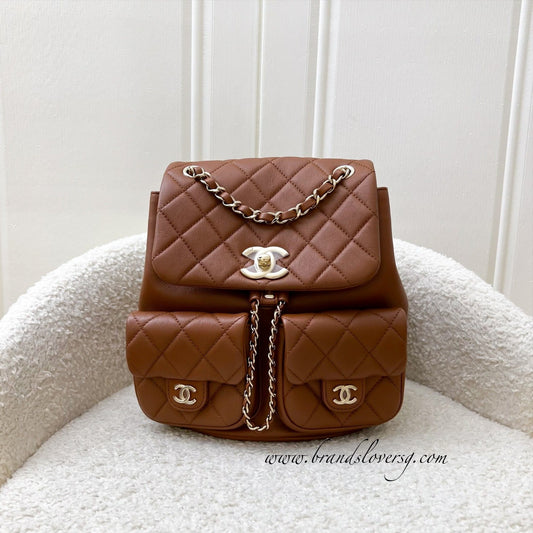 Chanel Medium Triple Backpack in 23A Cognac Brown Calfskin and LGHW (Model: AS3860)