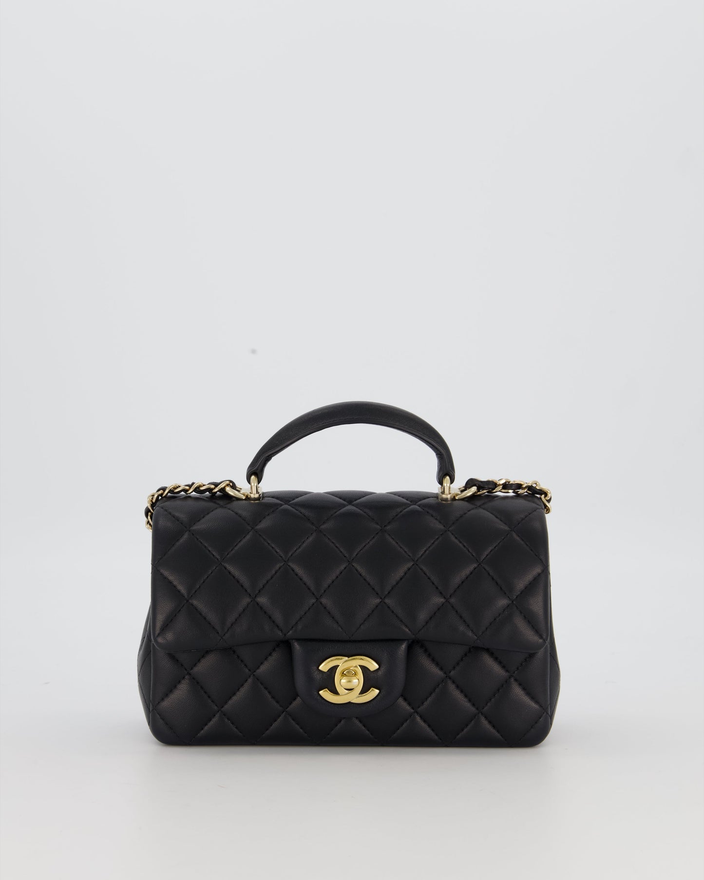 Chanel Black Mini Rectangular Top Handle Flap Bag in Lambskin Leather with Champagne Hardware and Strass Removable Bow Charm
