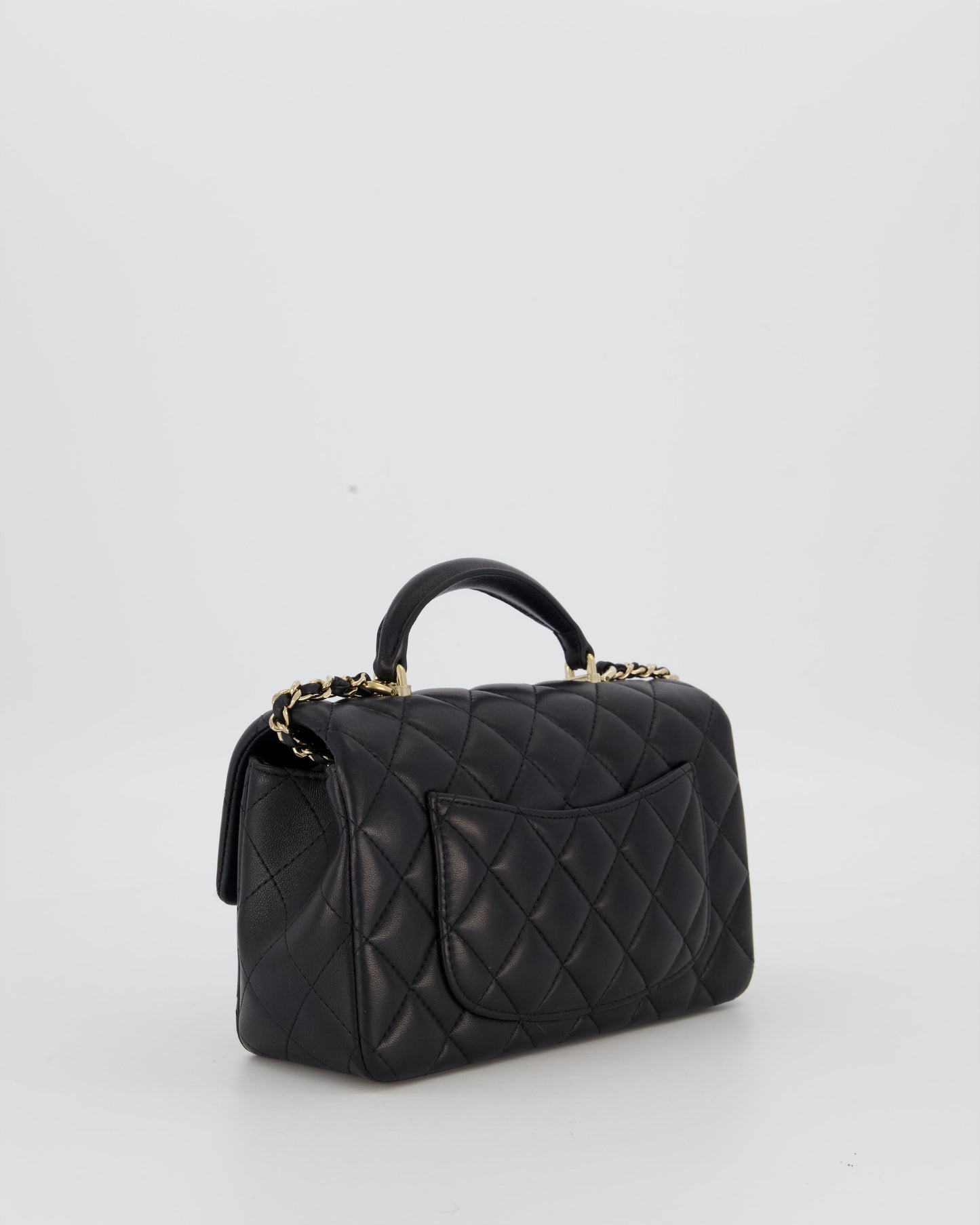 Chanel Black Mini Rectangular Top Handle Flap Bag in Lambskin Leather with Champagne Hardware and Strass Removable Bow Charm