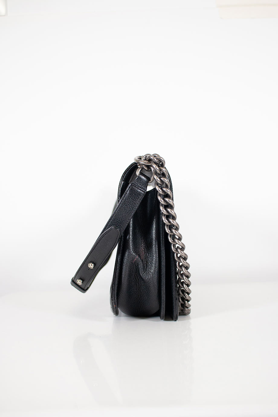 CHANEL Black grained calfskin quilted Boy bag with ruthenium finish hardware and patent border in New Medium size