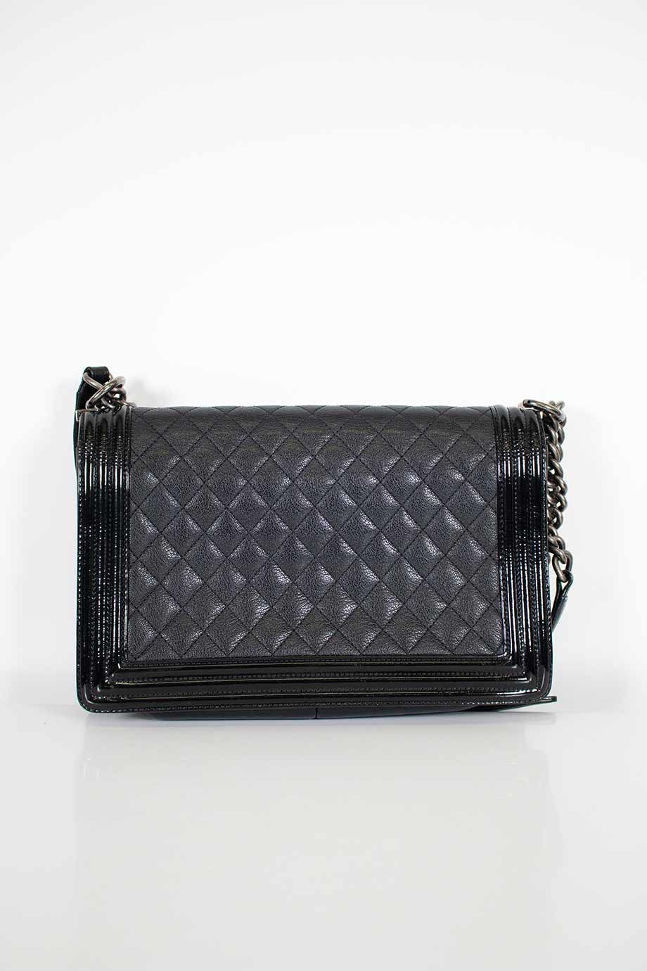 CHANEL Black grained calfskin quilted Boy bag with ruthenium finish hardware and patent border in New Medium size